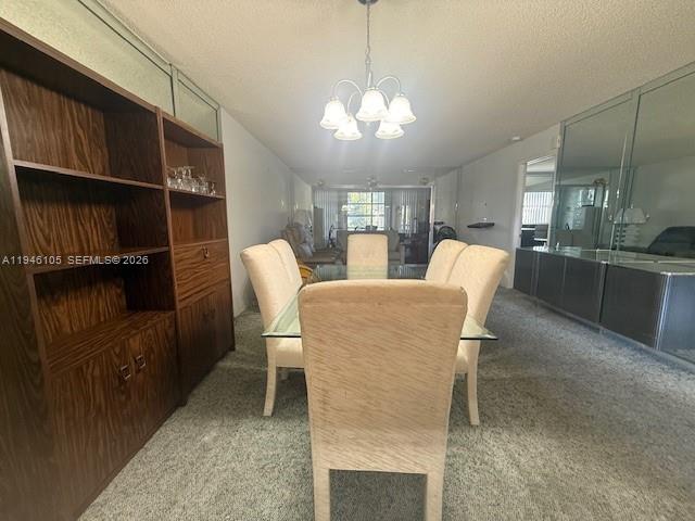 8818 West McNab Road, Unit 206 Tamarac, FL 33321 - Photo 6 of 9 a view of a dining room with furniture