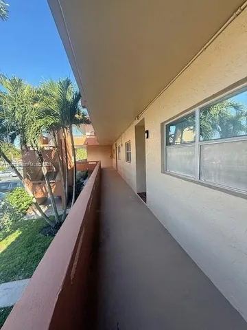 a view of backyard of a house