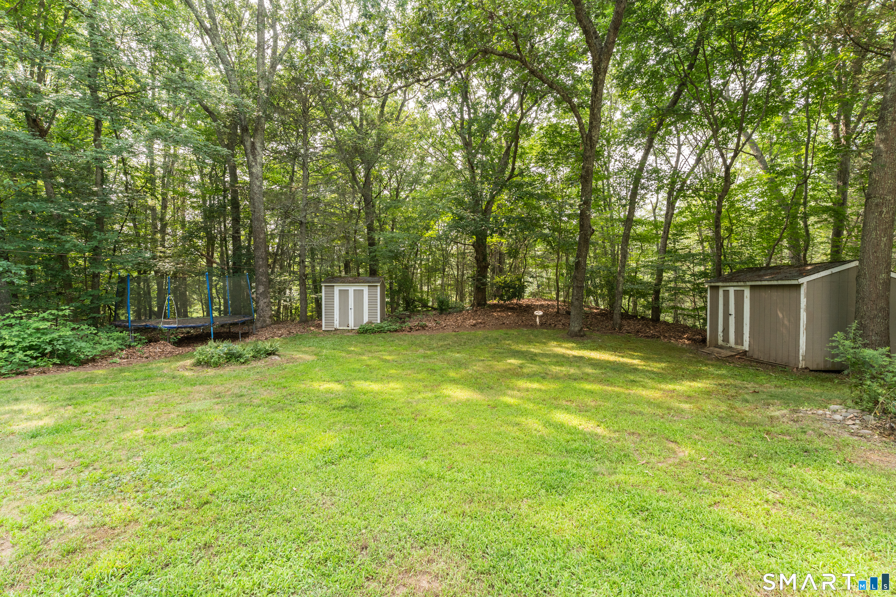 91 Whippoorwill Road Old Lyme, CT 06371 - Photo 5 of 25 2 sheds keep garden tools and yard equipment tidy and handy while the large, dry basement provides storage in the house