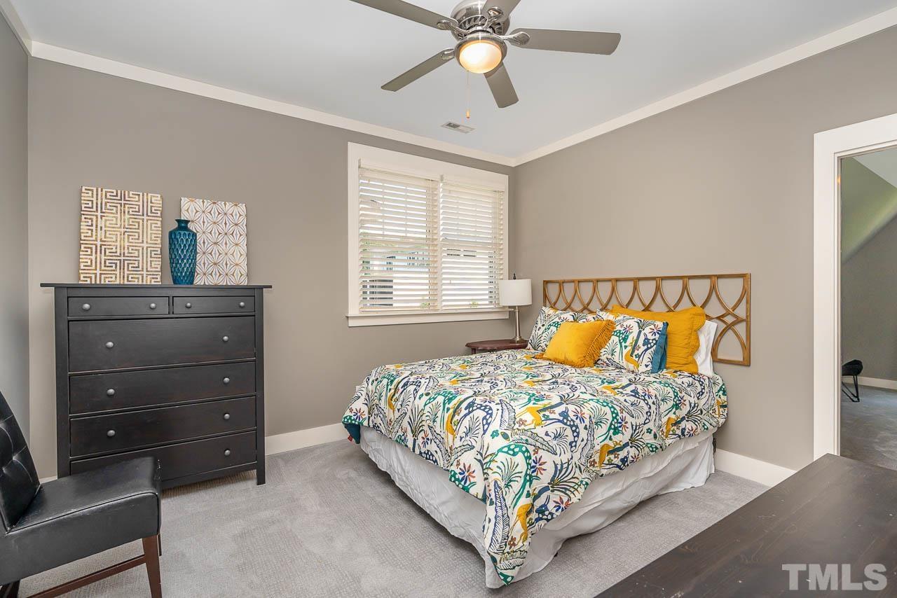 8615 Oneal Road Raleigh, NC 27613 - Photo 45 of 58 a bedroom with a bed and a dresser