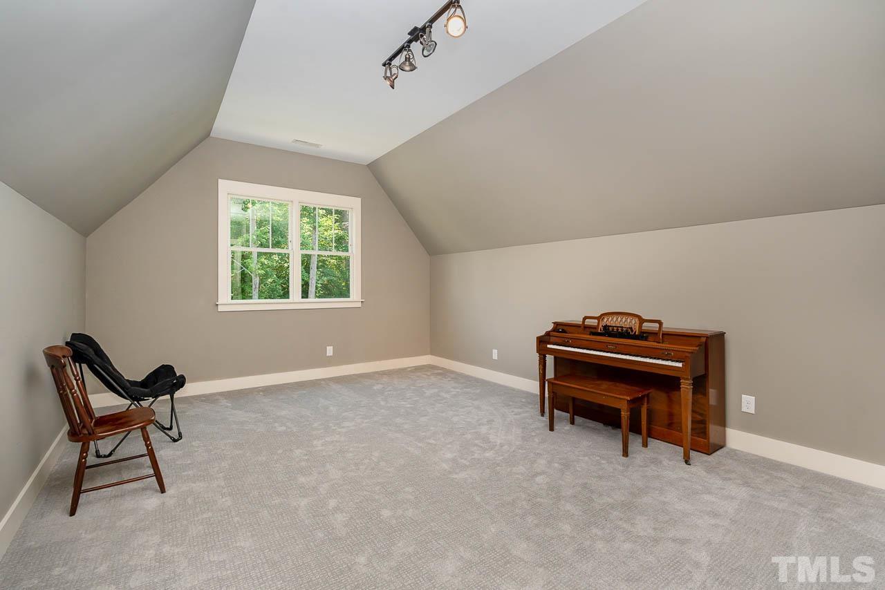 8615 Oneal Road Raleigh, NC 27613 - Photo 47 of 58 a view of a room with furniture and a window