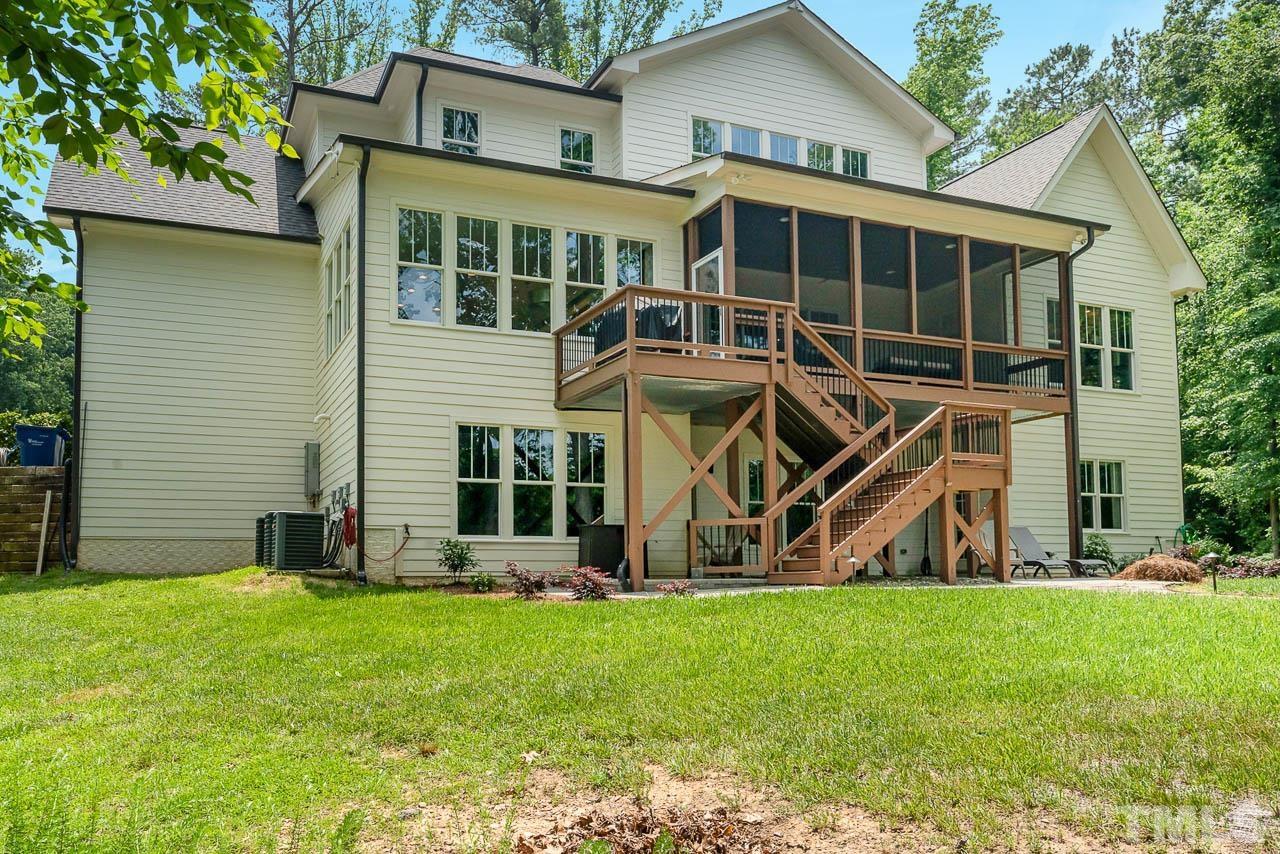 8615 Oneal Road Raleigh, NC 27613 - Photo 54 of 58 a view of a house with a yard and a large tree