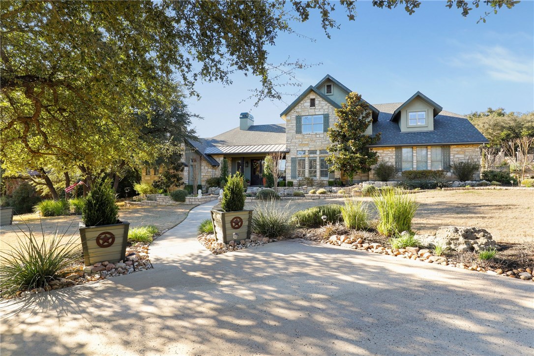 3511 Goodnight Trail Leander, TX 78641 - Photo 1 of 1 a front view of a house with a yard and lake view