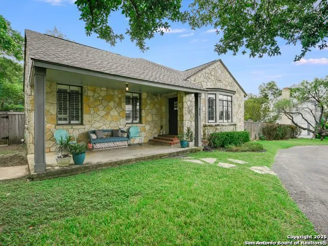 a view of a house with a yard porch and sitting area
