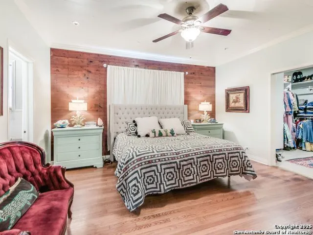 a bedroom with a bed and a couch