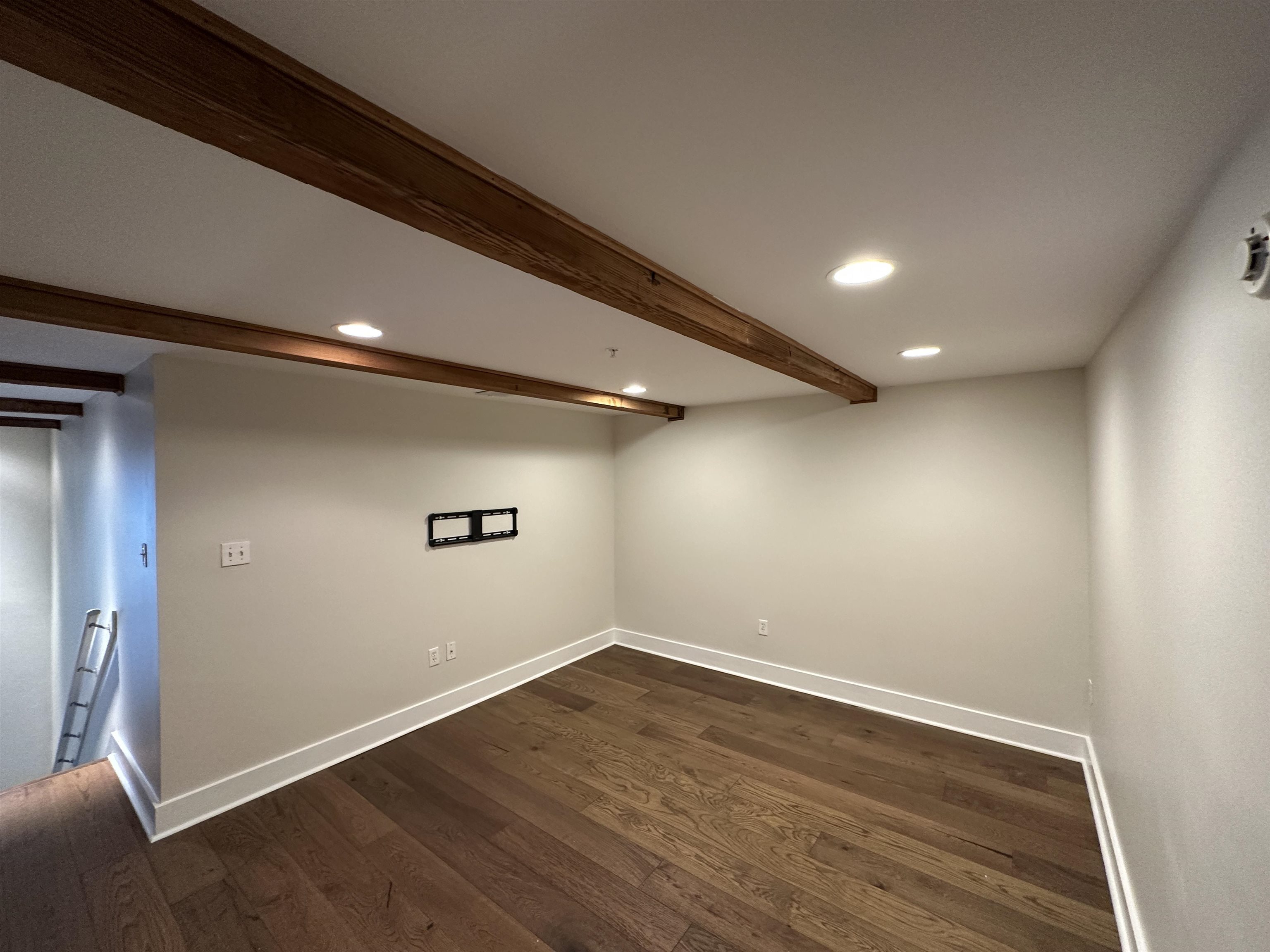 435 South Front Street, Unit 109 Memphis, TN 38103 - Photo 10 of 25 Finished basement with recessed lighting and dark wood-style floors