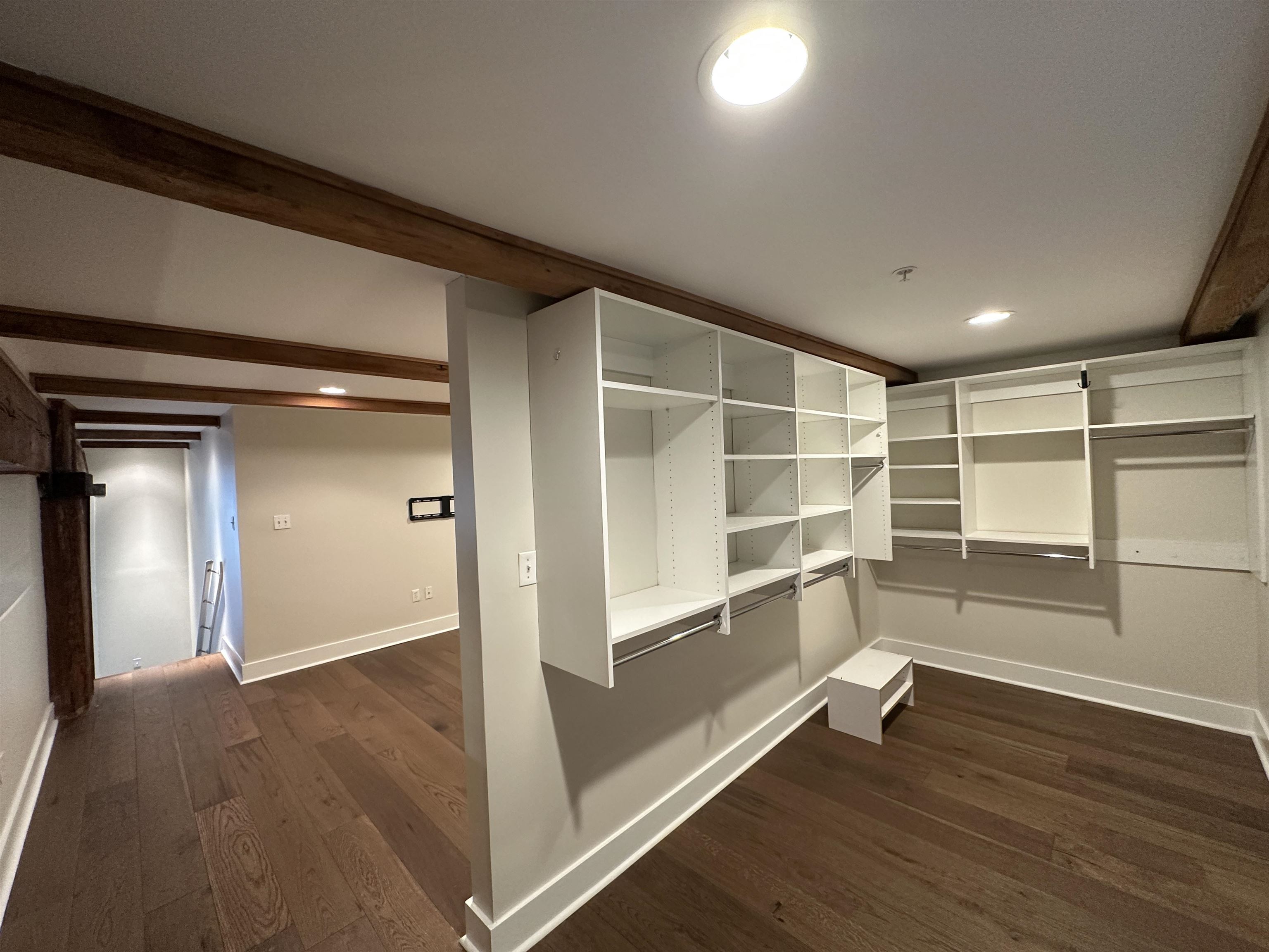 435 South Front Street, Unit 109 Memphis, TN 38103 - Photo 13 of 25 Walk in closet featuring dark wood-style flooring