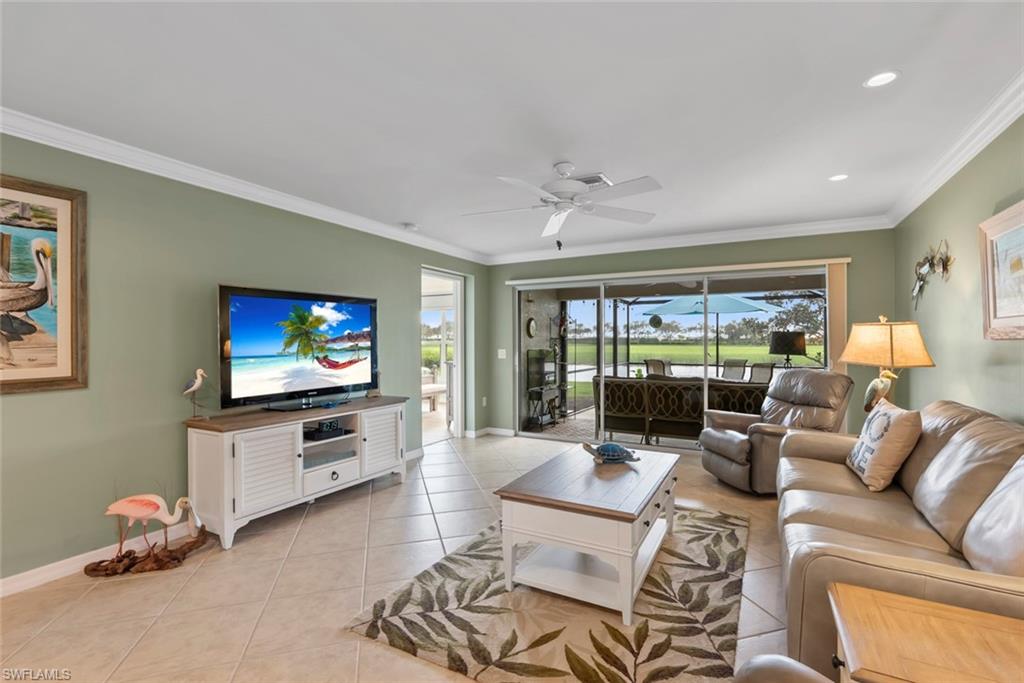 5796 Declaration Court Ave Maria, FL 34142 - Photo 13 of 49 a living room with furniture and a flat screen tv