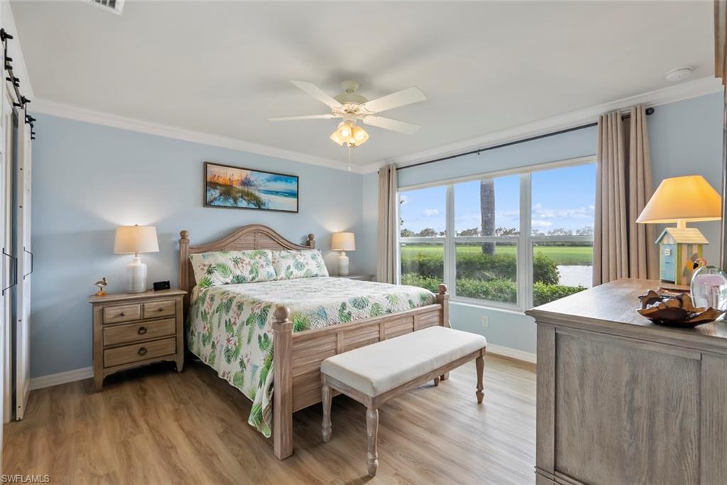 5796 Declaration Court Ave Maria, FL 34142 - Photo 16 of 49 a bedroom with a bed a large window with outer view and balcony view