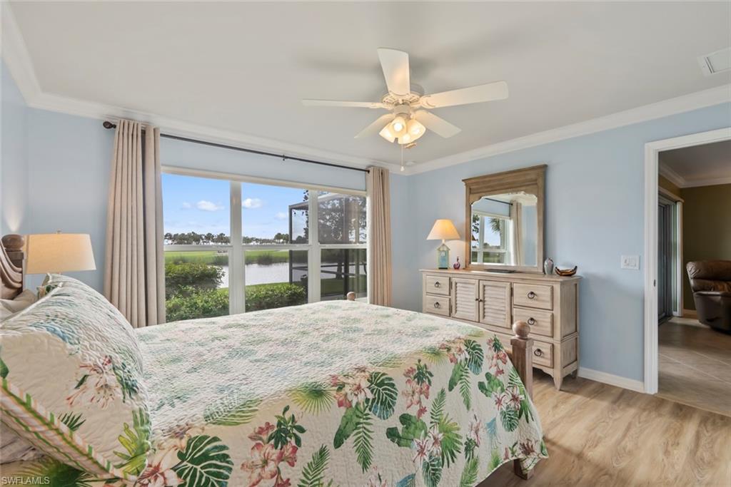 5796 Declaration Court Ave Maria, FL 34142 - Photo 17 of 49 a bedroom with a large bed and a window