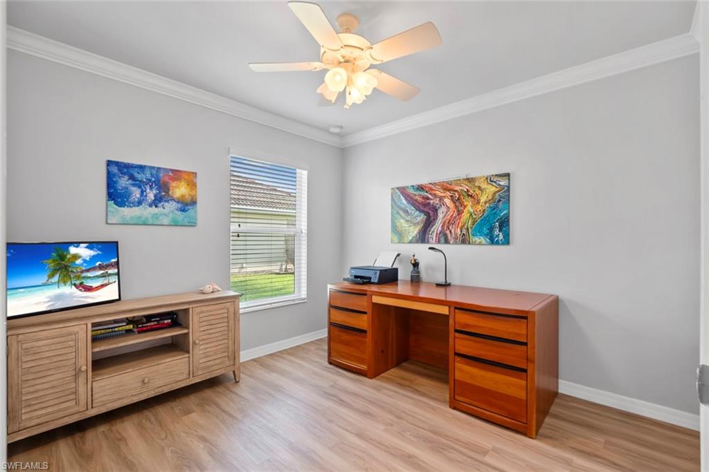 5796 Declaration Court Ave Maria, FL 34142 - Photo 20 of 49 a living room with stainless steel appliances furniture and a window