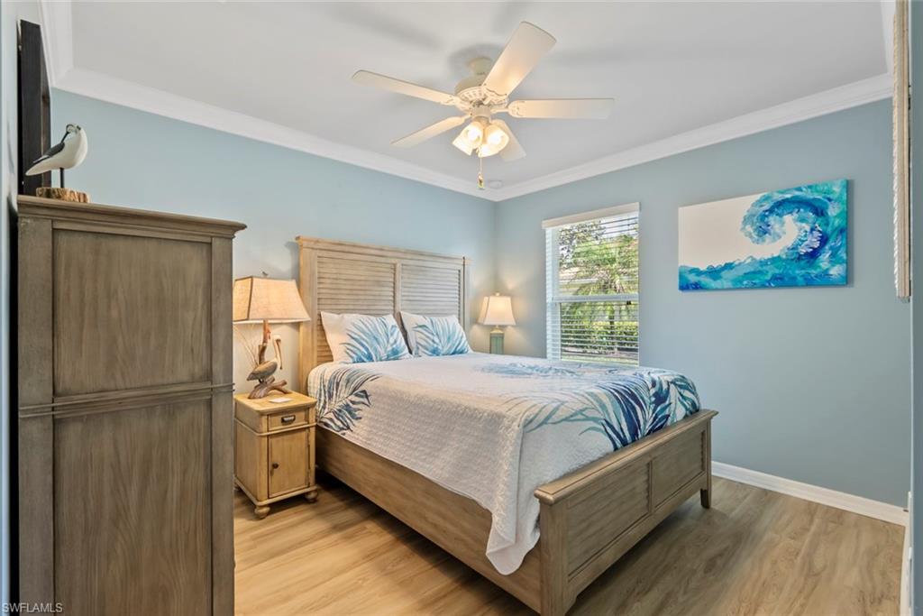 5796 Declaration Court Ave Maria, FL 34142 - Photo 21 of 49 a bedroom with a bed and a window
