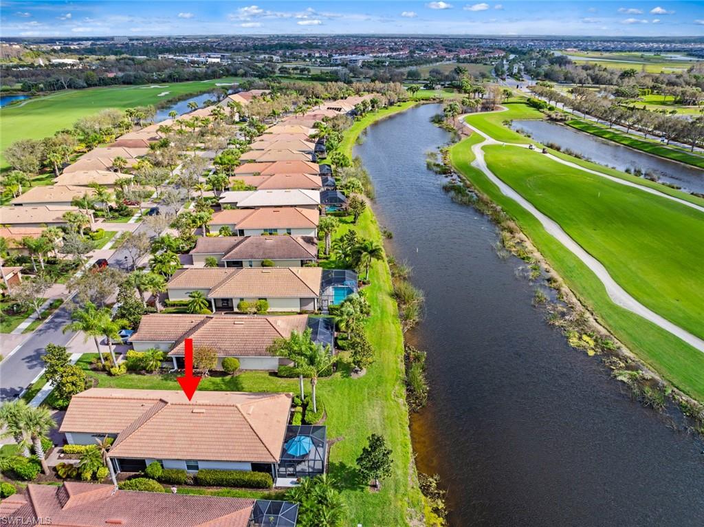 5796 Declaration Court Ave Maria, FL 34142 - Photo 32 of 49 an aerial view of a house with a garden and lake view