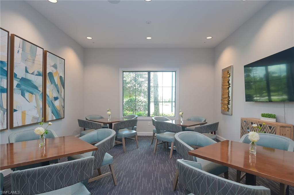 5796 Declaration Court Ave Maria, FL 34142 - Photo 36 of 49 a living room with furniture and a flat screen tv