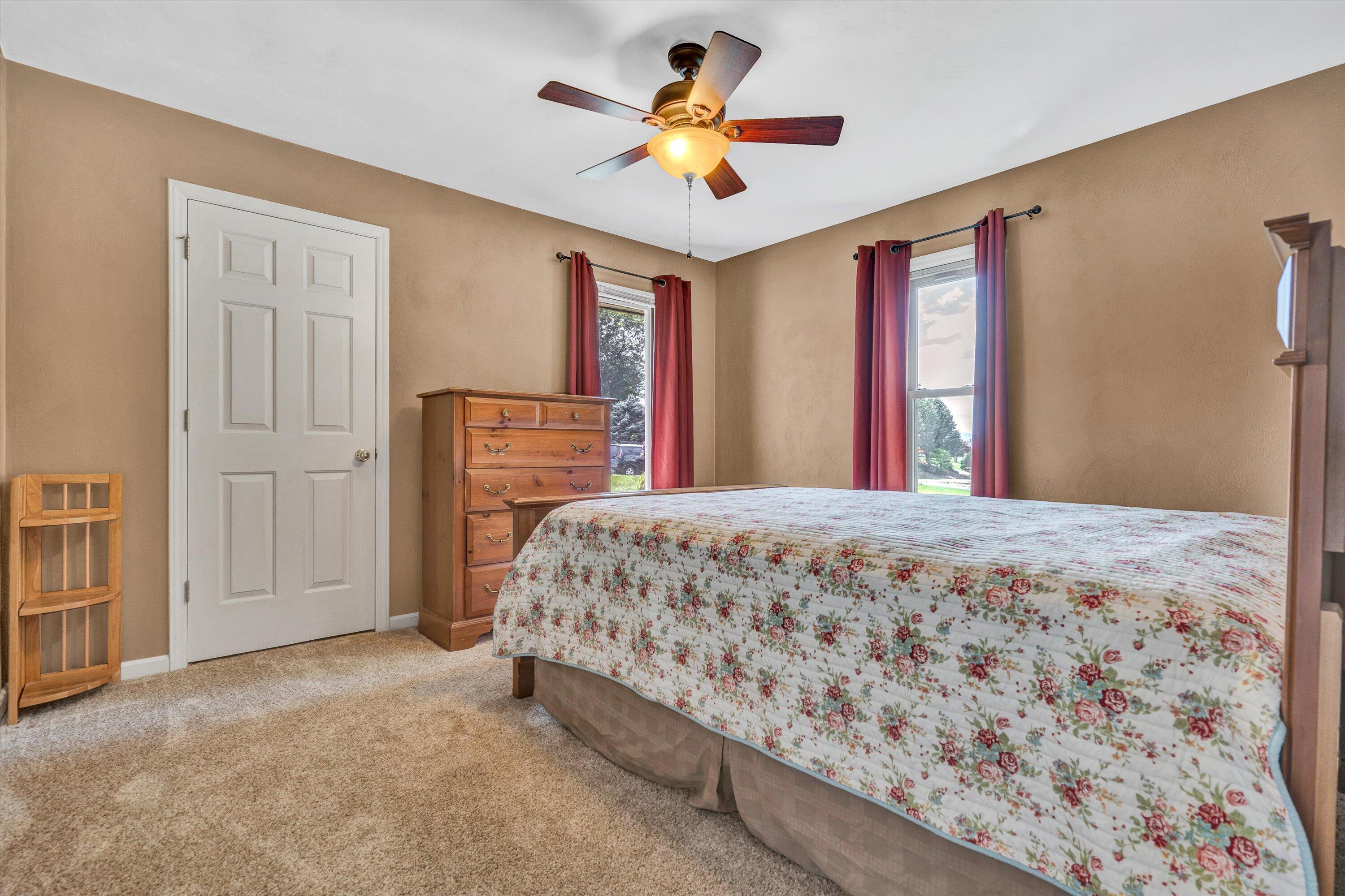 164 Deer Track Cloverdale, VA 24077 - Photo 17 of 28 a bedroom with a bed dresser and a window