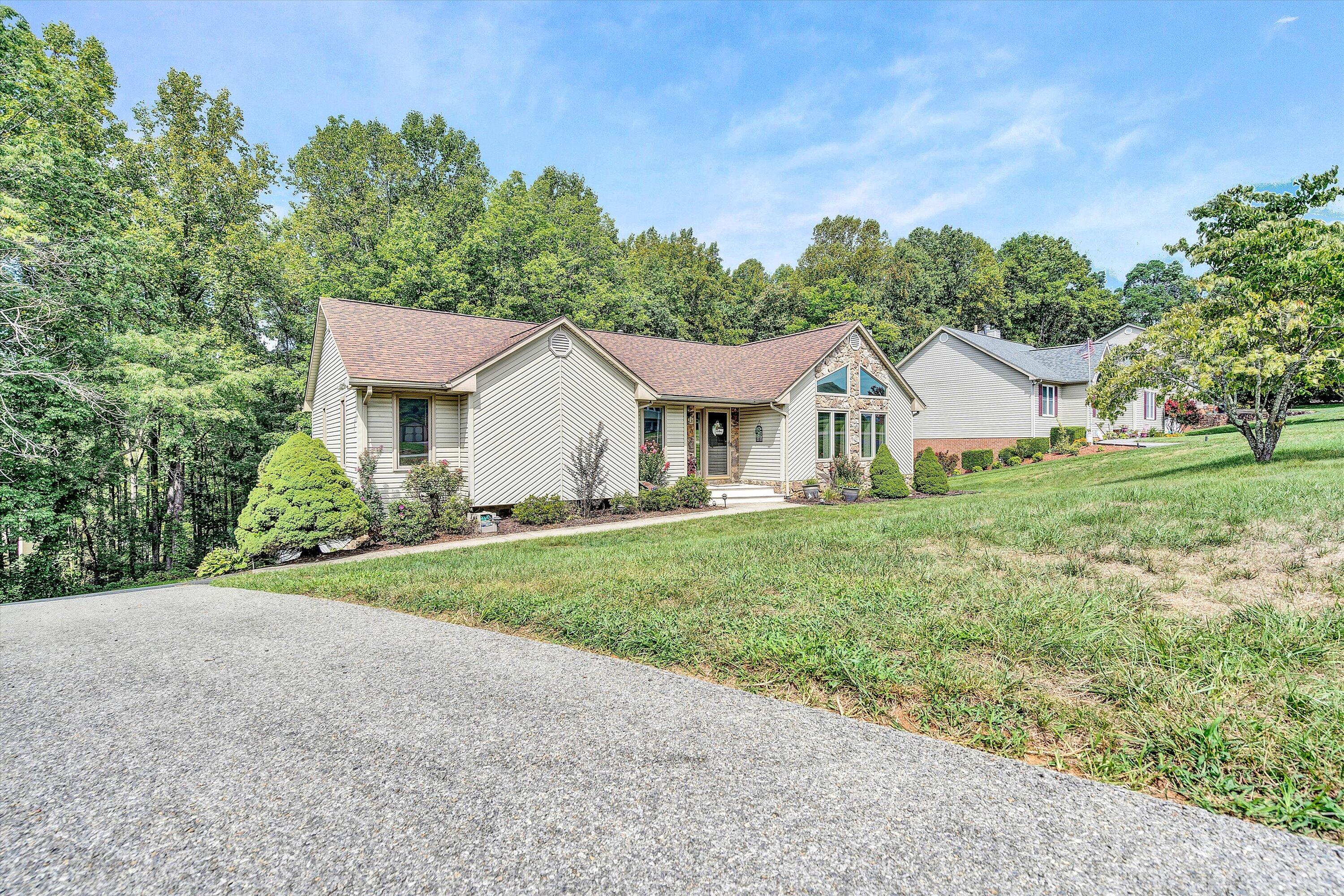 164 Deer Track Cloverdale, VA 24077 - Photo 2 of 28 a view of a house with yard and a garden