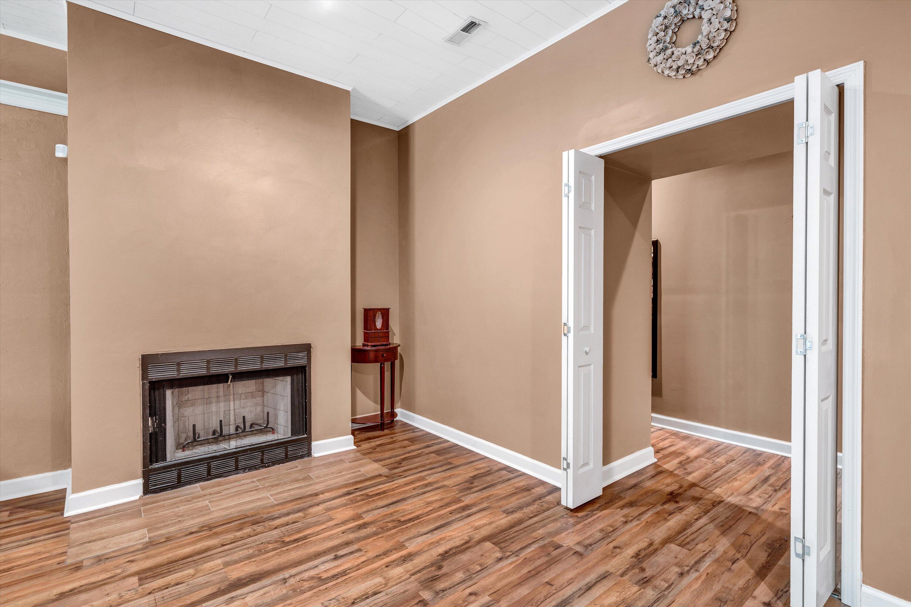 164 Deer Track Cloverdale, VA 24077 - Photo 22 of 28 a view of an empty room with wooden floor and a fireplace