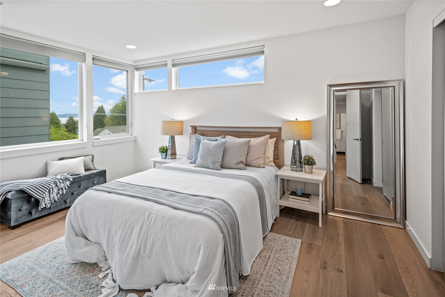4205 Southwest Frontenac Street Seattle, WA 98136 - Photo 18 of 39 a bedroom with a bed and wooden floor