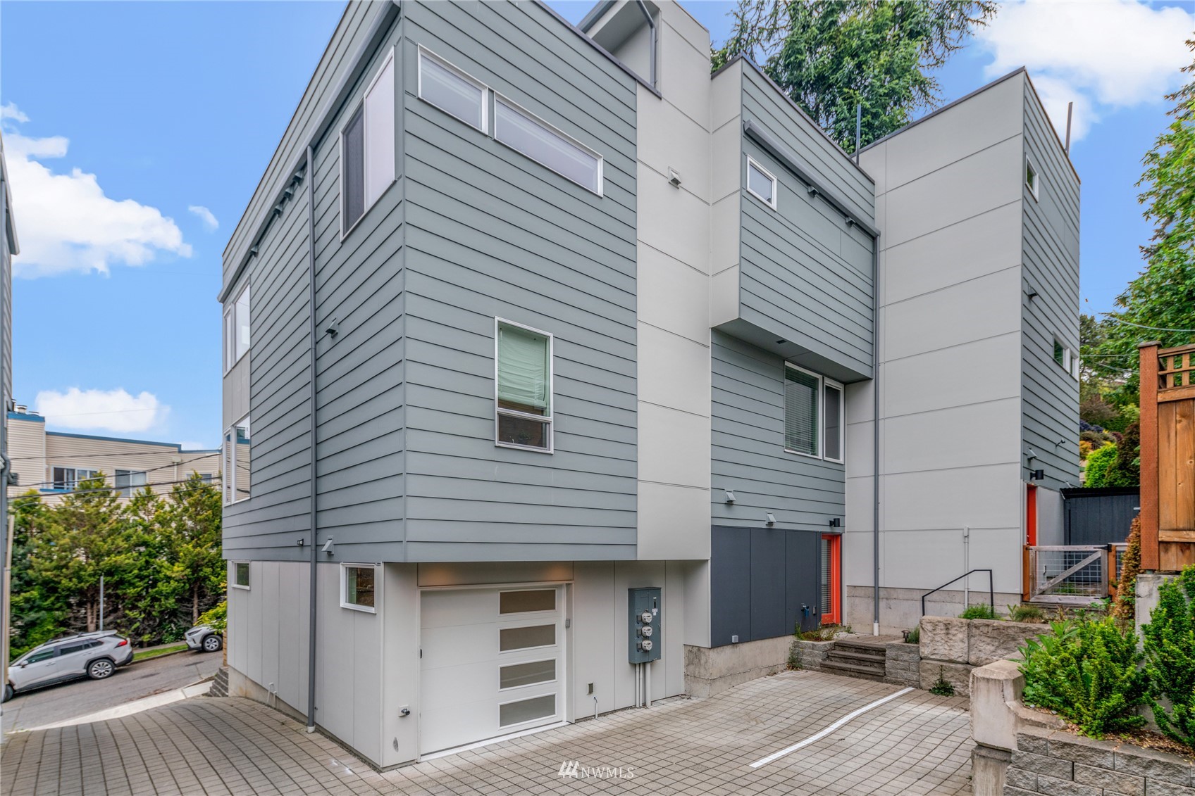 4205 Southwest Frontenac Street Seattle, WA 98136 - Photo 29 of 39 a view of a house with a yard and potted plants