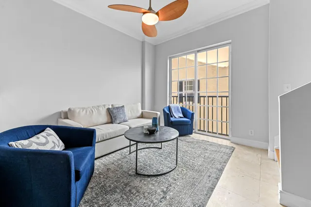 a living room with furniture and a window
