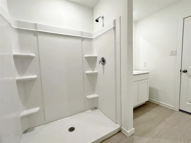 a bathroom with a tub and sink