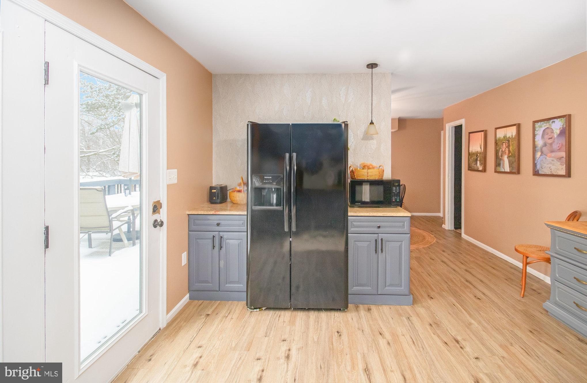 6811 Redground Road Fredericksburg, VA 22407 - Photo 9 of 37 Lux Vinyl Plank Floors & Subway Tile Backsplash