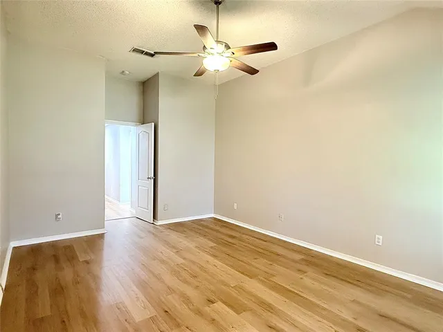 a bathroom with a tub sink shower and mirror