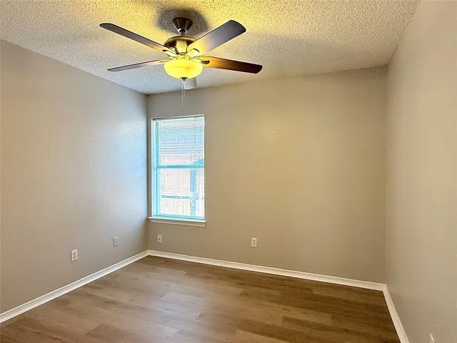 an empty room with a bookshelf