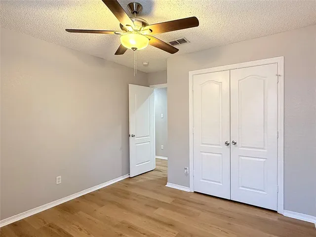 a bathroom with a double vanity sink mirror and toilet