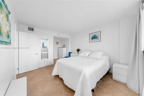 a living room with furniture and white walls