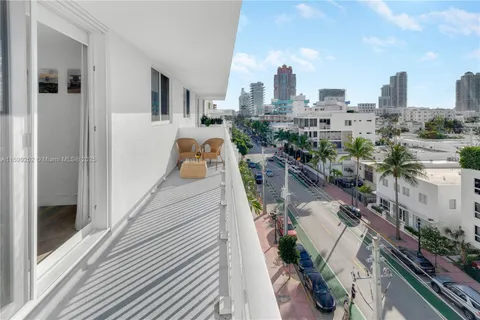a view of swimming pool with a table and chairs
