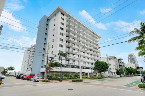 a view of city with ocean