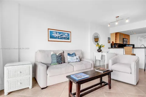 a view of roof deck with table and chairs and wooden floor