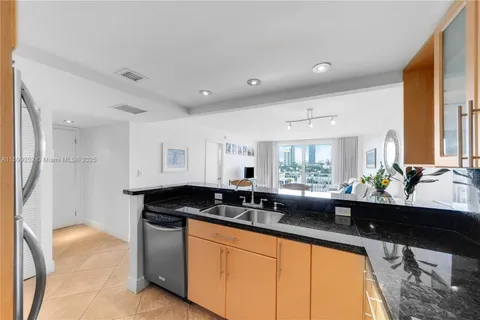 a kitchen with wooden cabinets and a stove top oven