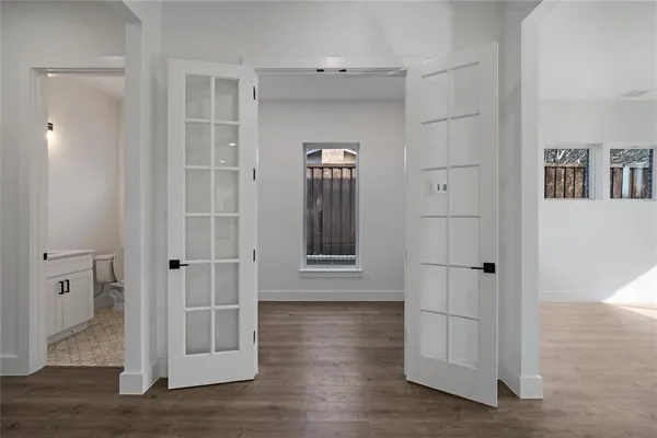 a view of hallway with wooden floor