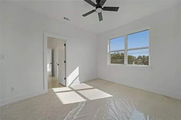 a view of an empty room with a window