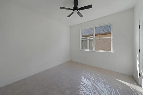 a view of empty room with windows
