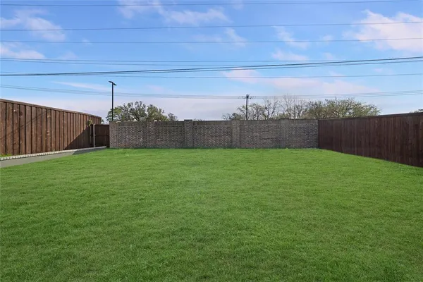a view of yard with porch and a yard