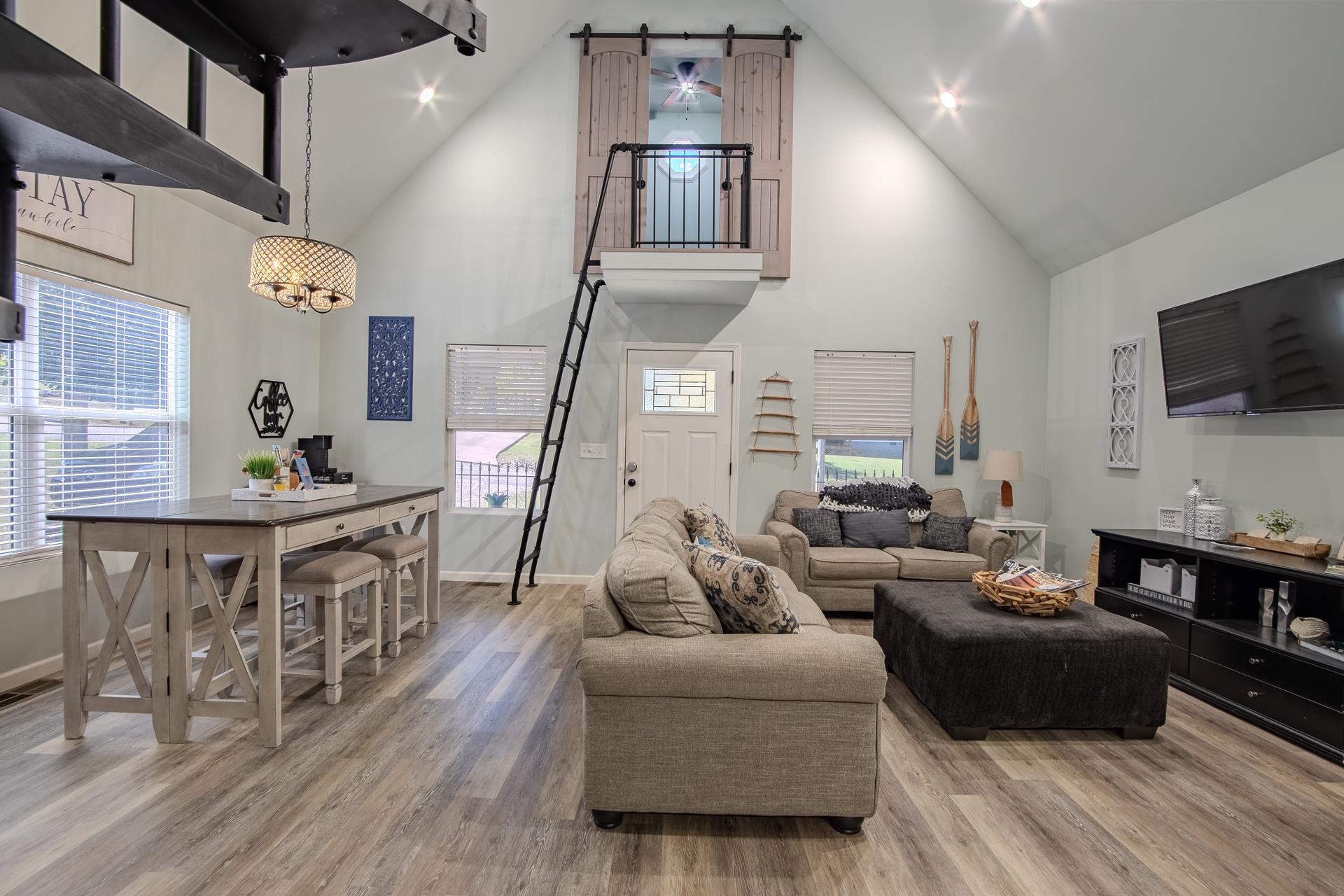 25 Bogey Loop Counce, TN 38326 - Photo 7 of 37 Living area featuring high vaulted ceiling, light wood-style floors, and recessed lighting
