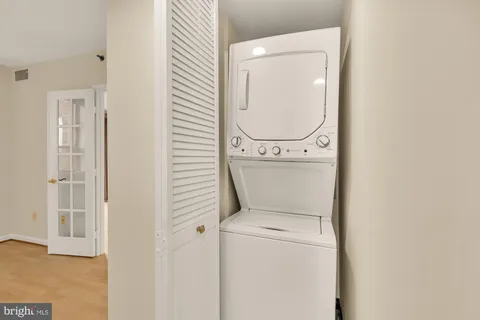 a close view of a utility room with dryer and washer