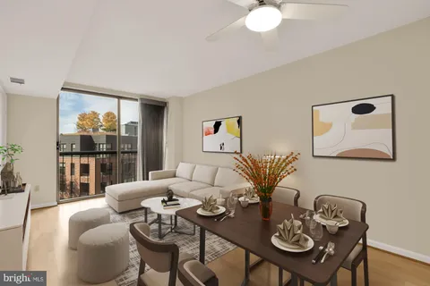 a living room with furniture and a table