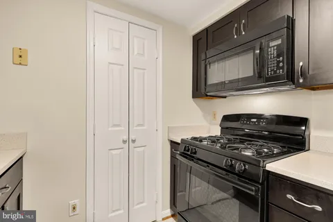 a kitchen with a stove and a microwave