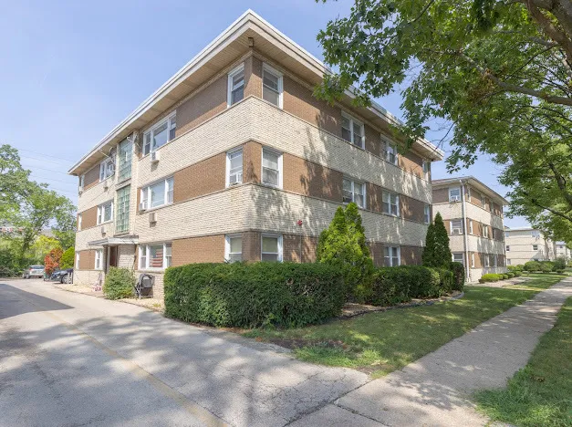 a view of a building with a yard
