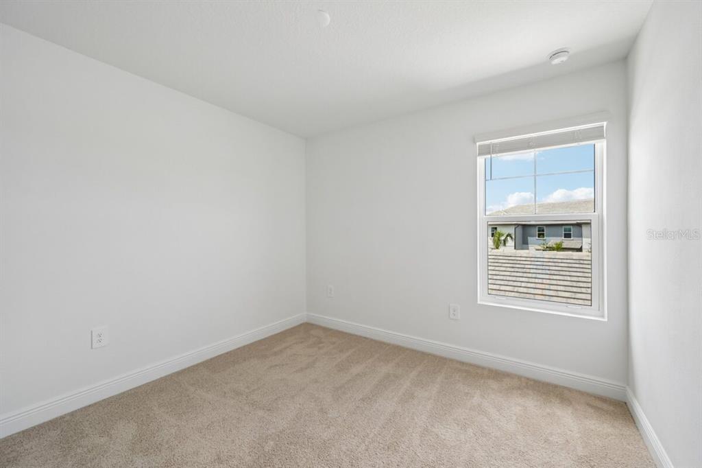 17712 Broadleaf Loop Venice, FL 34293 - Photo 13 of 23 an empty room with a window