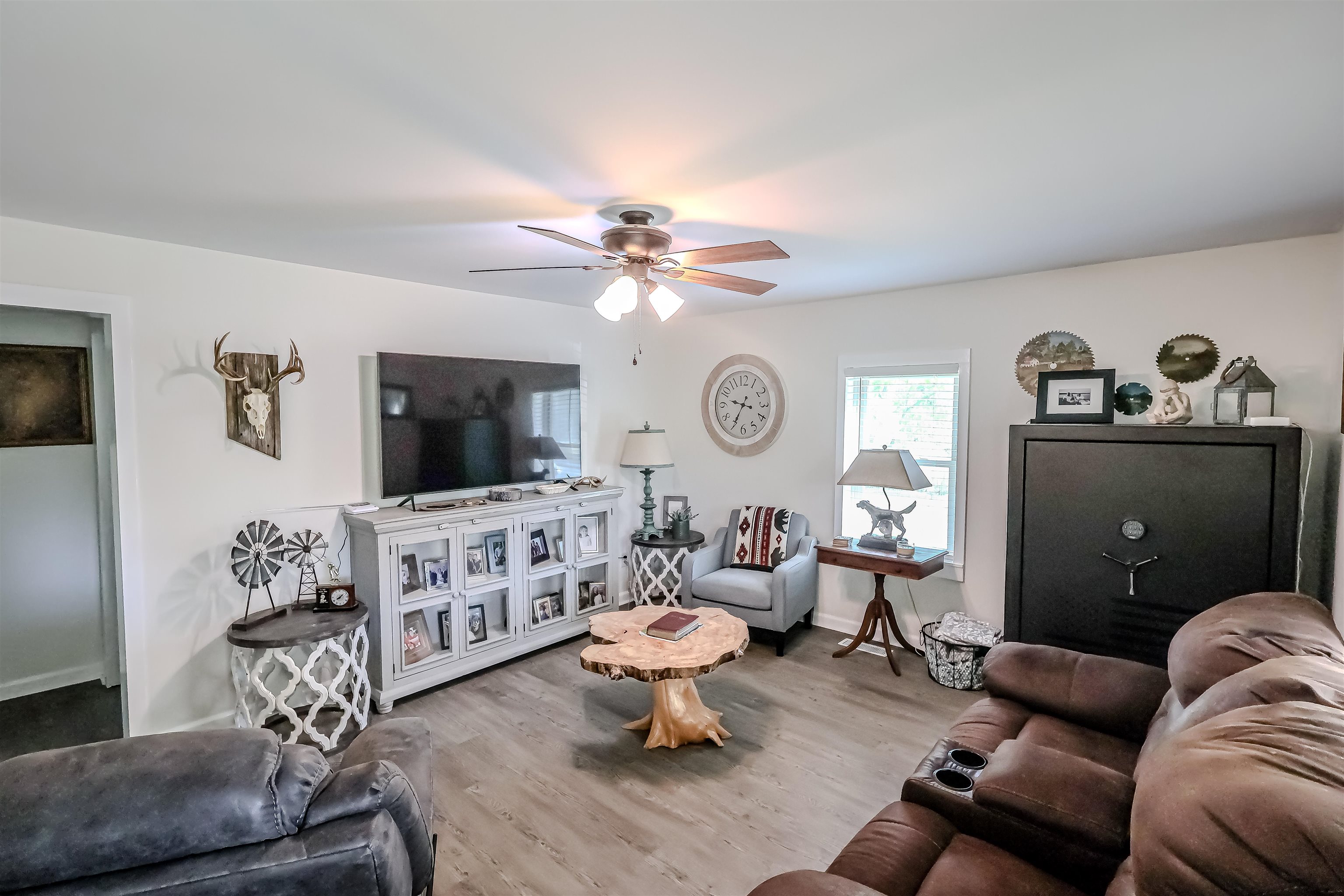 6264 Asbury Glimp Road Ripley, TN 38063 - Photo 6 of 18 Living room featuring baseboards, wood finished floors, and ceiling fan