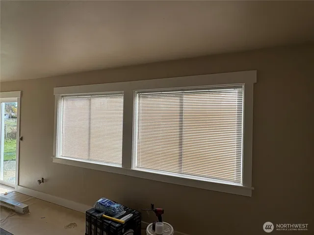 a view of a room that has a window in it