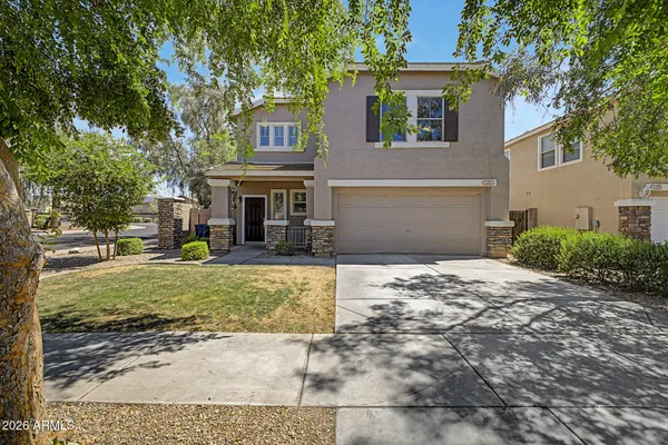 front view of a house with a yard