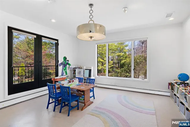 a view of a dining room with furniture window and outside view