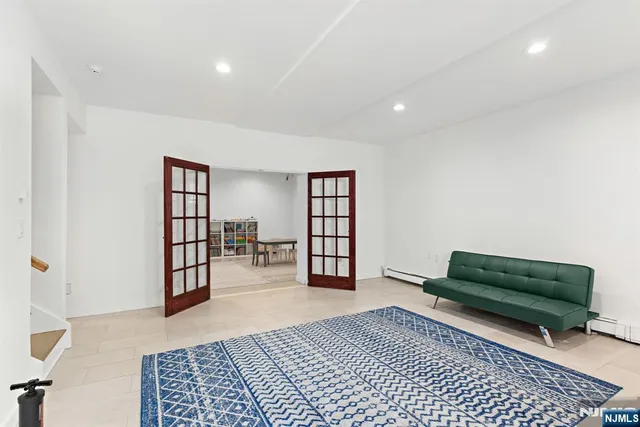 a living room with furniture and a rug