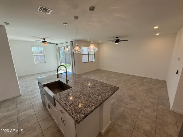 a view of an empty room and a glass door
